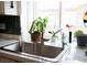 Close-up of kitchen sink and window with natural light at 6808 Indian Chief Dr # 204, Las Vegas, NV 89130