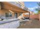 Outdoor kitchen and cozy seating area offer great back patio space for entertaining at 6837 Dragonfly Rock St, Las Vegas, NV 89148