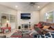 Comfortable living room with modern fireplace, stylish rug, and relaxed leather seating at 6837 Dragonfly Rock St, Las Vegas, NV 89148