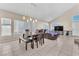 Dining room features a table, chairs, and large windows at 7741 Falconwing Ave, Las Vegas, NV 89131