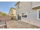 Cozy backyard patio with brick pavers and landscaping at 10414 White Princess Ave, Las Vegas, NV 89166