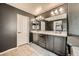 Double vanity bathroom with dark cabinets and a modern design at 10414 White Princess Ave, Las Vegas, NV 89166