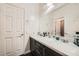 Modern bathroom with dual sinks and a large vanity at 10414 White Princess Ave, Las Vegas, NV 89166