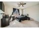 Well-lit bedroom with a comfortable bed and a workspace at 10414 White Princess Ave, Las Vegas, NV 89166