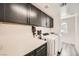 Laundry room with upper cabinets, washer and dryer, and vinyl flooring at 10414 White Princess Ave, Las Vegas, NV 89166