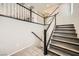 Modern staircase with gray wood-look treads and white railings at 10414 White Princess Ave, Las Vegas, NV 89166