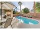 Inviting backyard oasis with a sparkling pool, spa, and patio area at 11009 Pentland Downs St, Las Vegas, NV 89141