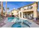 Inviting backyard oasis featuring a sparkling pool and spa, perfect for relaxation at 11009 Pentland Downs St, Las Vegas, NV 89141