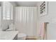 Small bathroom with shower and white polka dot curtain at 11009 Pentland Downs St, Las Vegas, NV 89141