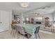 Elegant dining room with a stylish chandelier and seating for six at 11009 Pentland Downs St, Las Vegas, NV 89141