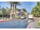 Community entrance with guard house, landscaping, and palm trees at 11009 Pentland Downs St, Las Vegas, NV 89141