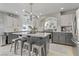 Modern kitchen with an island, stainless steel appliances and gray cabinets at 11009 Pentland Downs St, Las Vegas, NV 89141