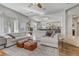 Bright and airy living room with sectional sofa and hardwood floors at 11009 Pentland Downs St, Las Vegas, NV 89141