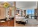 Spacious bedroom with a king-size bed and stunning city views at 125 E Harmon Ave # 3716, Las Vegas, NV 89109