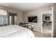 Luxurious bedroom with large TV and access to a sitting area at 222 Karen Ave # 401, Las Vegas, NV 89109