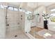 Large walk-in shower with marble tile and built-in seat at 5 Moonfire Dr, Las Vegas, NV 89135