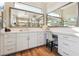 Vanity area with white cabinets and a large mirror at 5 Moonfire Dr, Las Vegas, NV 89135