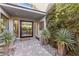 Elegant entryway with a glass door and courtyard view at 5 Moonfire Dr, Las Vegas, NV 89135