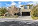 Contemporary home with stone facade and paver driveway at 5 Moonfire Dr, Las Vegas, NV 89135