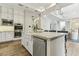 Modern kitchen features a farmhouse sink, granite countertops, and stainless steel appliances at 5 Moonfire Dr, Las Vegas, NV 89135