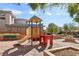 playground with a slide and play structure at 5 Moonfire Dr, Las Vegas, NV 89135