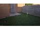 Small backyard with artificial turf and a concrete patio at 6311 W Washington Ave, Las Vegas, NV 89107