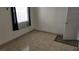 Small bedroom with tiled floors and window at 6311 W Washington Ave, Las Vegas, NV 89107