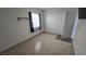 Bright bedroom featuring tile floors and a window with curtains at 6311 W Washington Ave, Las Vegas, NV 89107