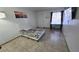 Bright bedroom with tiled floors and a queen-size bed at 6311 W Washington Ave, Las Vegas, NV 89107