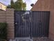 Black metal gate providing access to the property at 6311 W Washington Ave, Las Vegas, NV 89107