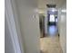 Hallway with tile floors and a view into the kitchen at 6311 W Washington Ave, Las Vegas, NV 89107