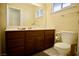 Clean bathroom with vanity, toilet, and mirror at 7393 Puritan Ave, Las Vegas, NV 89123