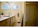 Clean bathroom with double vanity, shower, and plenty of counter space at 7393 Puritan Ave, Las Vegas, NV 89123