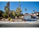 Single story home with a landscaped front yard, attached garage, and driveway at 7393 Puritan Ave, Las Vegas, NV 89123