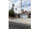 Single story home with tile roof, two-car garage, and desert landscaping at 7393 Puritan Ave, Las Vegas, NV 89123