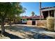 Front yard view of a house with a brick wall and gate at 7393 Puritan Ave, Las Vegas, NV 89123