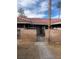 Spanish style home with red tile roof and gated entryway at 7393 Puritan Ave, Las Vegas, NV 89123