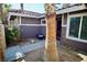 Front entry with a walkway, landscaping and a palm tree at 7393 Puritan Ave, Las Vegas, NV 89123