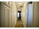 Clean hallway with carpet flooring and access to bedrooms at 7393 Puritan Ave, Las Vegas, NV 89123