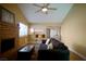 Living room with fireplace, kitchen bar and comfy seating at 7393 Puritan Ave, Las Vegas, NV 89123