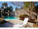 Relaxing pool area with lounge chair at 7393 Puritan Ave, Las Vegas, NV 89123