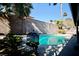 Inviting pool area with fire pit and plenty of space for relaxation at 7393 Puritan Ave, Las Vegas, NV 89123