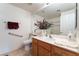 Bright bathroom featuring white cabinets, sink, and accessible features at 10710 Destination Ln # 201, Las Vegas, NV 89144