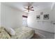 Neutral bedroom with a ceiling fan, comfortable bed and lots of natural light at 10710 Destination Ln # 201, Las Vegas, NV 89144