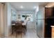 A view of the dining area adjacent to the kitchen, featuring stainless steel appliances at 10710 Destination Ln # 201, Las Vegas, NV 89144