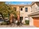 Charming two-story townhome entrance with well-maintained landscaping at 10710 Destination Ln # 201, Las Vegas, NV 89144