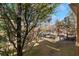 View of the landscaped grounds and parking area from a condo balcony at 10710 Destination Ln # 201, Las Vegas, NV 89144