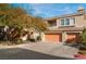 Inviting two-story home with a three-car garage and mature landscaping at 10710 Destination Ln # 201, Las Vegas, NV 89144