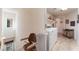 Bright laundry room with modern washer and dryer, shelving, and natural light at 10710 Destination Ln # 201, Las Vegas, NV 89144