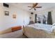 The main bedroom features a ceiling fan, carpeted floors, and windows at 10710 Destination Ln # 201, Las Vegas, NV 89144